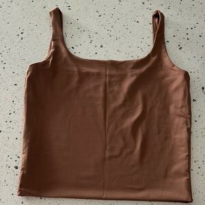New, never worn brown stretch tank